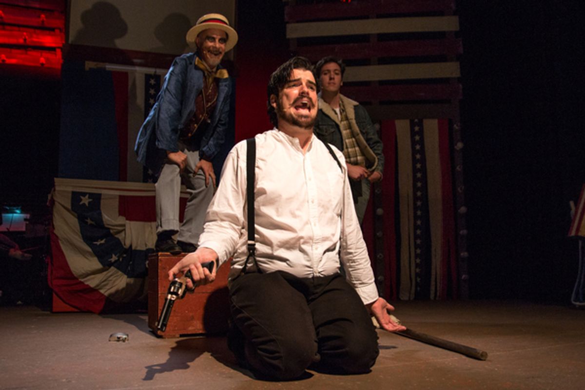 (L to R) Will Shupe as The Proprietor, Chris Kerrigan kneeling as John Wilkes Booth, Levi Gotsman as The Balladeer. at 
