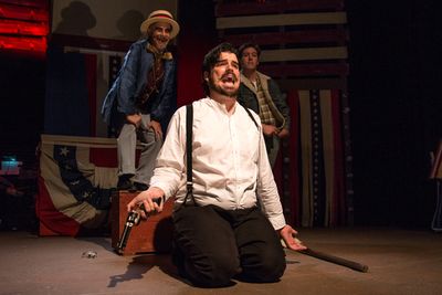(L to R) Will Shupe as The Proprietor, Chris Kerrigan kneeling as John Wilkes Booth,  Photo