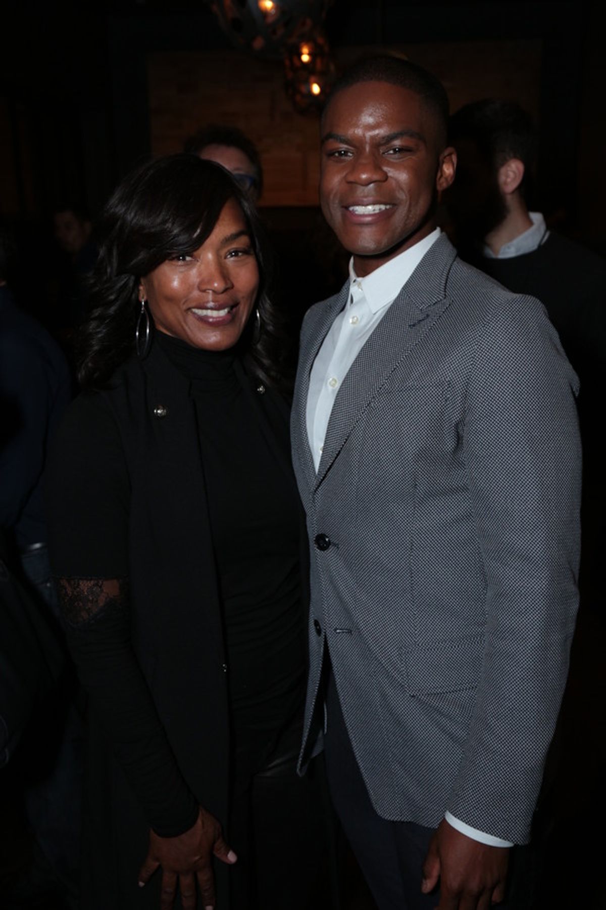 Angela Bassett poses with Jovan Adepo  at 