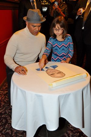 Daughter Jadelyn picks out spot for Christopher Jackson to sign his caricature @ BroadwayWorld Daughter Jadelyn picks out spot for Christopher Jackson to sign his caricature Photo