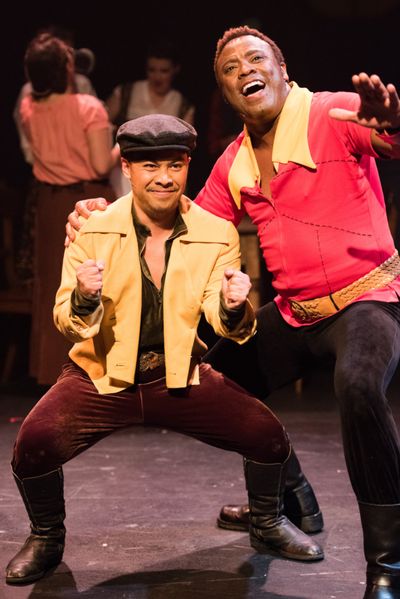 Gaston (PHILLIP PERCY WILLIAMS) and Le Fou (DOMINIC DAGDAGAN) scheme for Belle's hand Photo