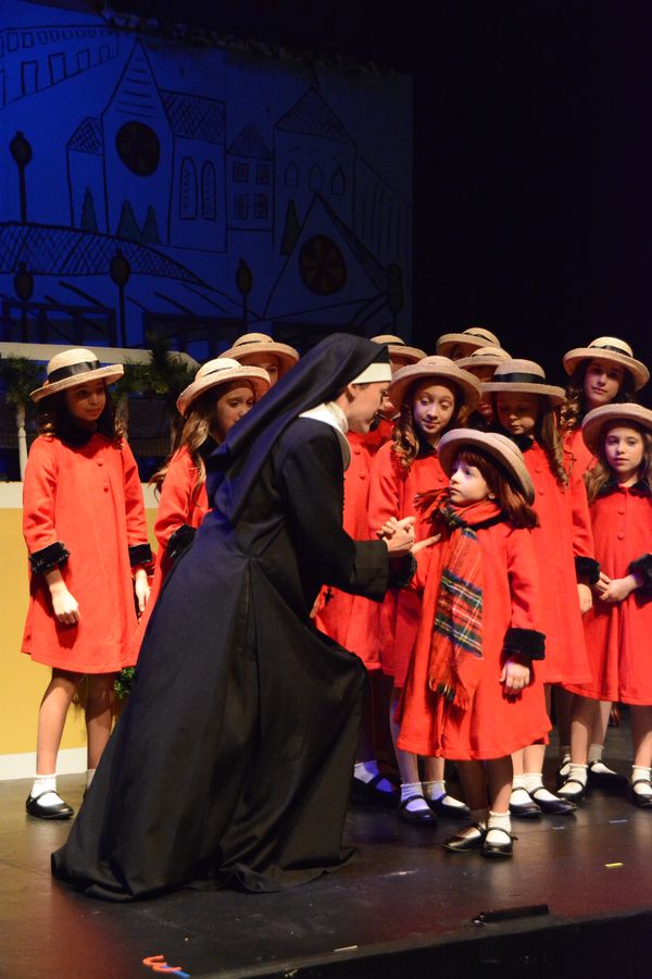 Macy Idzakovich, Sophie Knapp and the cast of Madeline's Christmas Photo
