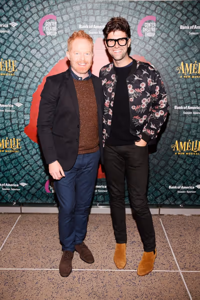 From left, actor Jesse Tyler Ferguson and husband Justin Mikita arrive for the openin Photo