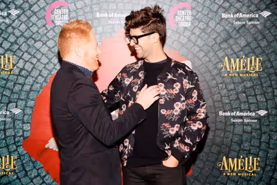 From left, actor Jesse Tyler Ferguson and husband Justin Mikita arrive for the openin Photo
