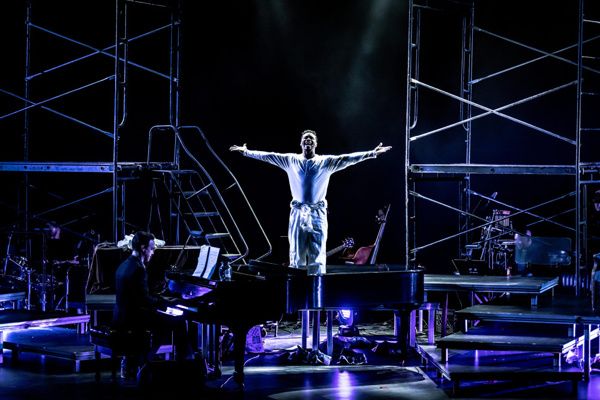 Kennen Butler (Man #1) with the Band of Songs For A New World. Photo