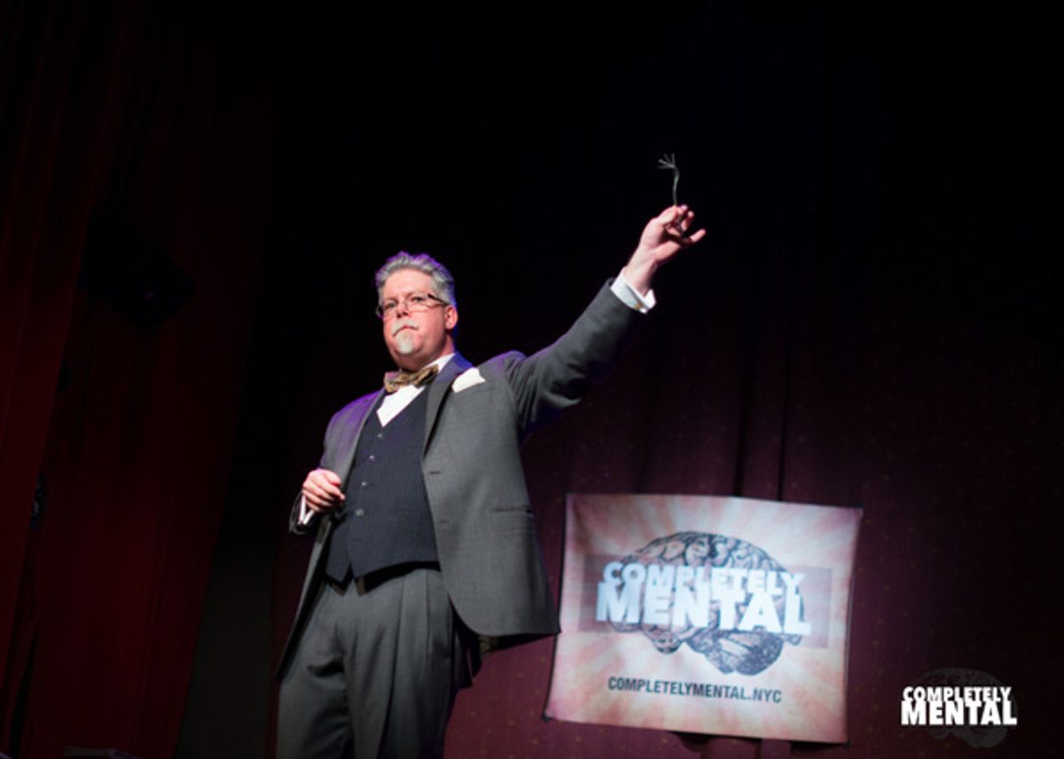 Mentalist Rory Raven uses his mind to do the unthinkable to a fork. (Photo by Allison Stock) at Second Installment of COMPLETELY MENTAL Hits The Slipper Room