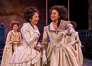 The Princess (Jennie Greenberry, at right) and Rosaline (Laura Rook) gleefully read t Photo