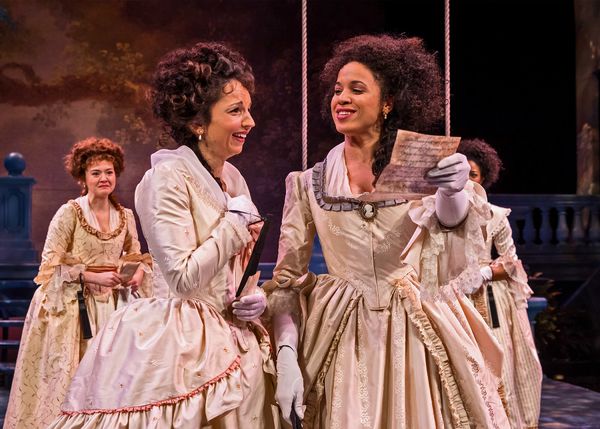 The Princess (Jennie Greenberry, at right) and Rosaline (Laura Rook) gleefully read t Photo