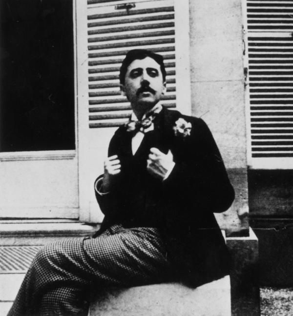 In this photograph, taken circa 1910,Â Marcel Proust posesÂ outside a window. The Photo