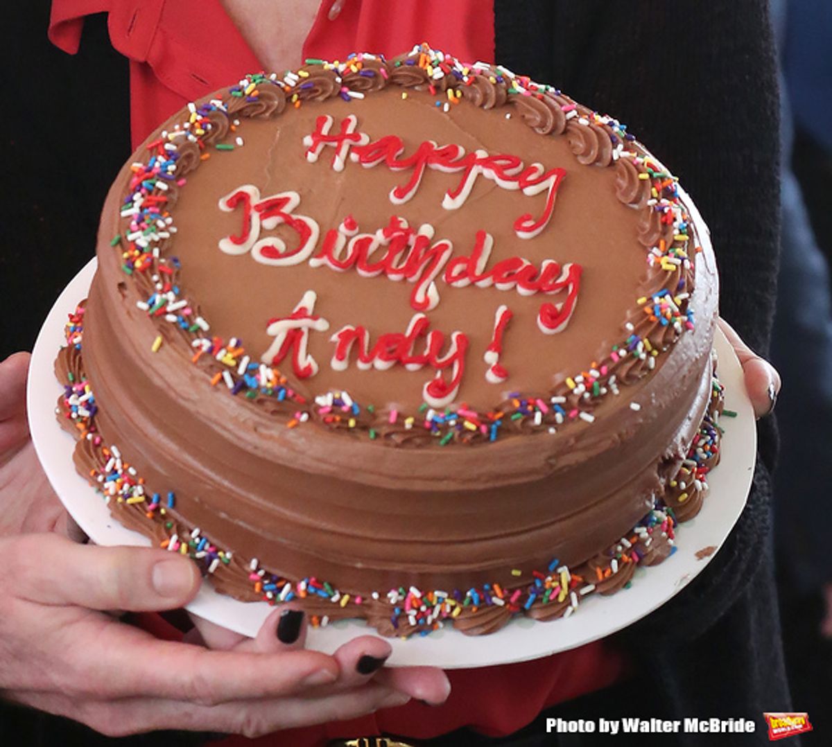 Beth Leavel and cast present  Andy Blankenbuehler with a Birthday Cake during the 'Bandstand' Broadway cast press presentation at the Rainbow Room on March 7, 2017 in New York City. at 