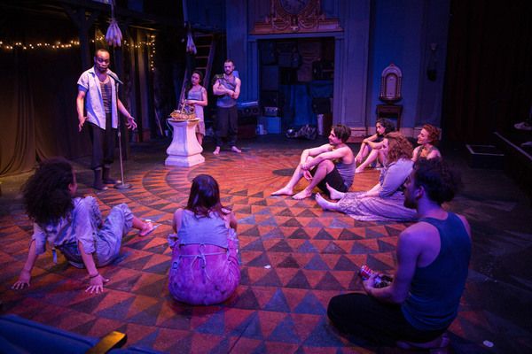 (far left) Johnard Washington with ensemble of  Red Tape Theatre and Walkabout Theate Photo