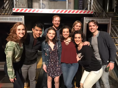 Ella Olivia Stiller and Christine Taylor (center) with the cast of IN TRANSIT Photo