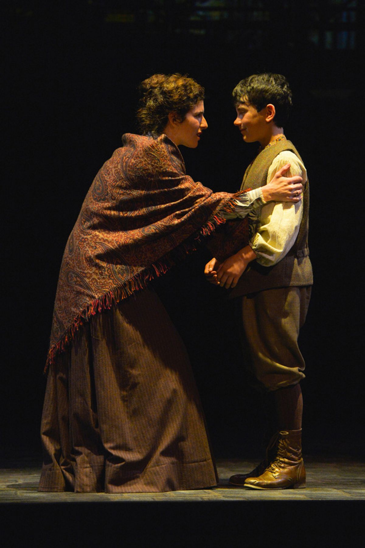 From L-R: Rebecca (Kyra Miller) explains to her son, David (Jonah Broscow) the aftermath of the fire in TheatreWorks Silicon Valley's Rags, a musical saga of immigrant America. Rags is presented at the Mountain View Center for the Performing Arts April no at 