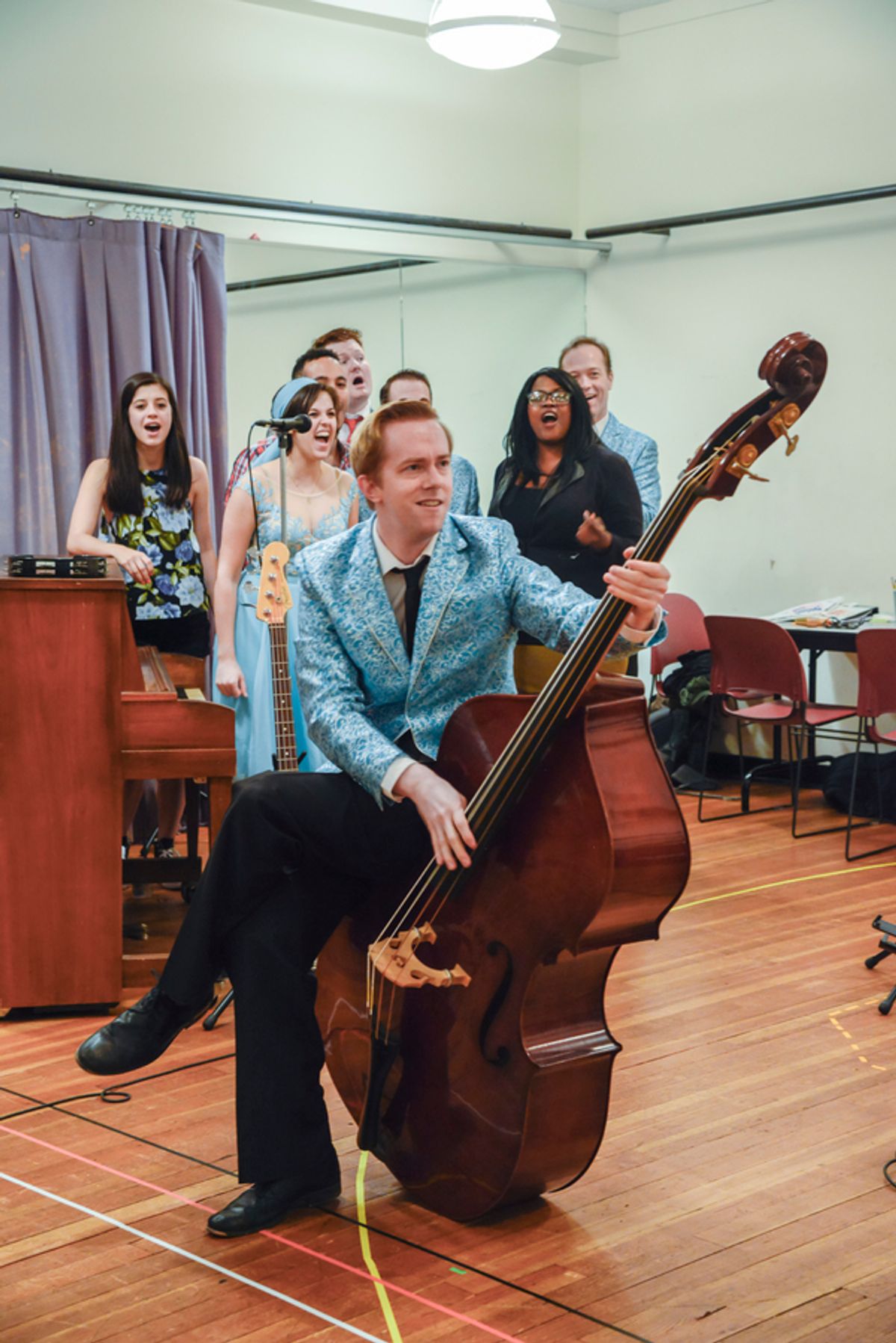 The cast of BUDDY: THE BUDDY HOLLY STORY in rehearsal at 