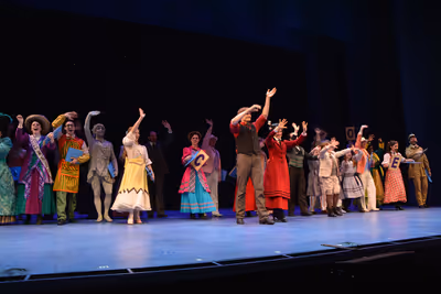Mark Evans and Elena Shadow with the cast of Mary Poppins Photo