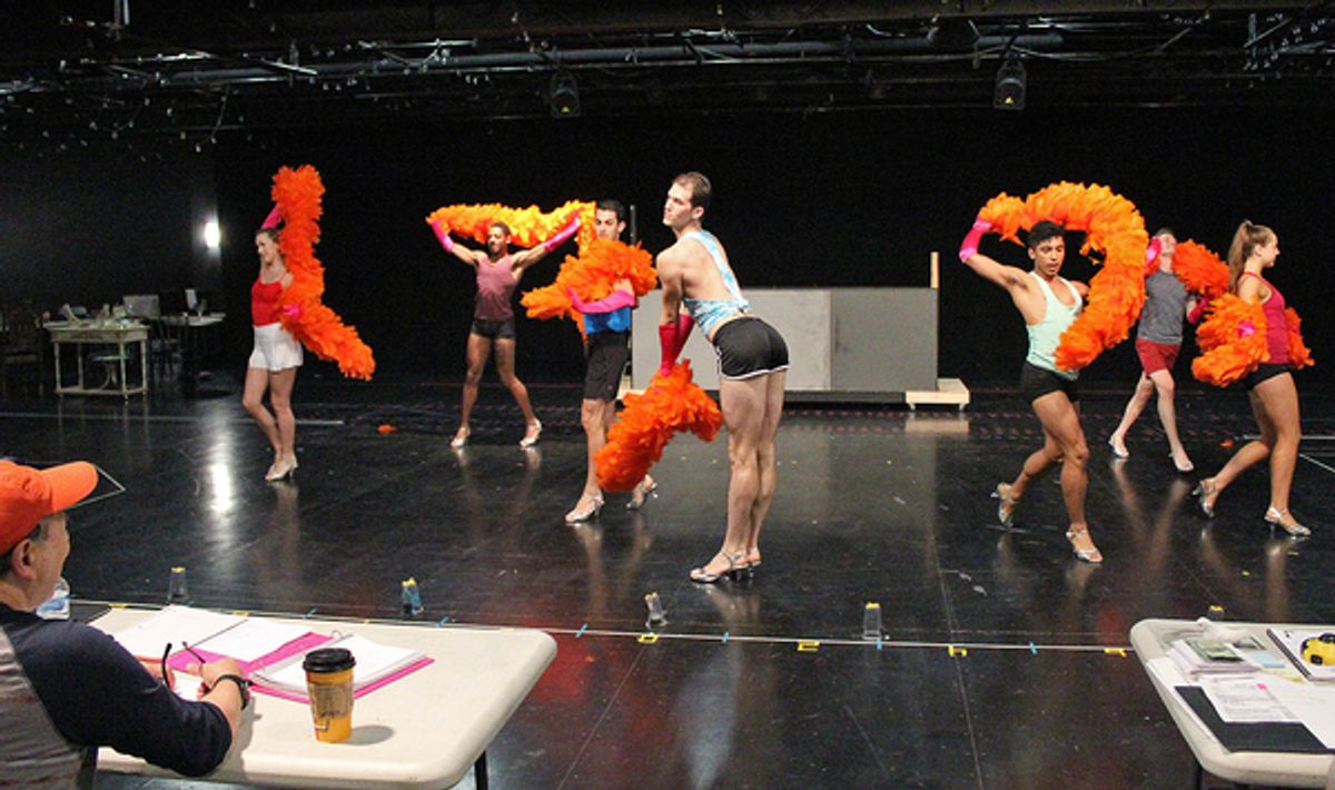 Director Bert Bernardi (lower left corner) looks on in a rehearsal of the opening number â€�"We Are What We Areâ€ performed by The Chagelles in Cortland Repertory Theatreâ€™s production of the flamboyant musical â€�"La Cage Aux Follesâ€ running from June  at 
