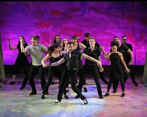 Dan Lusardi (center) as Ren McCormick and the cast perform the opening number â€" Photo