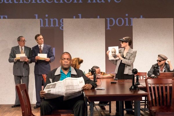 Greig Sargeant (center) and the company Photo