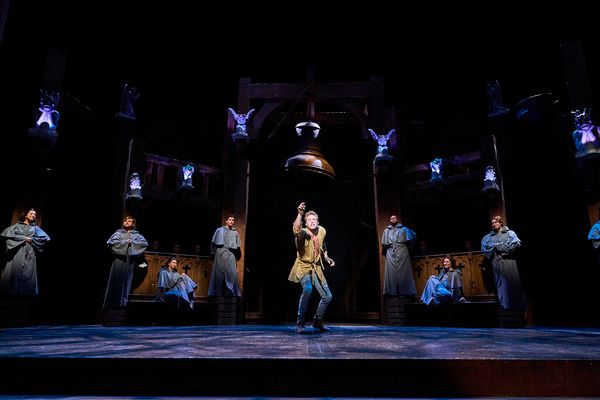 Quasimodo (Corey Mach*) greets his friends (Derrick Cobey*, Jillian Kates*, Olivia Ka Photo