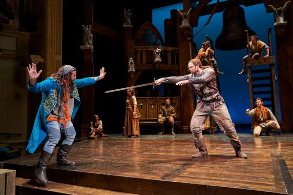 Clopin Trouillefou (Alex Syiek*) is confronted by Phoebus De Martin (Jon Loya*) with  Photo