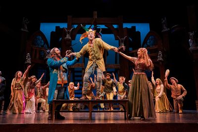 Quasimodo (Corey Mach*) is made the 'King of Fools' by Clopin (Alex Syiek*) and Esmer Photo
