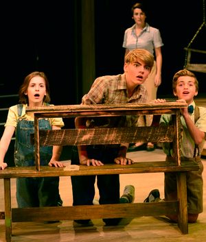 Foreground: L to R: Scout: Carly Williams & Jem: Nathaniel Oaks & Dill: Gabriel Magee Photo