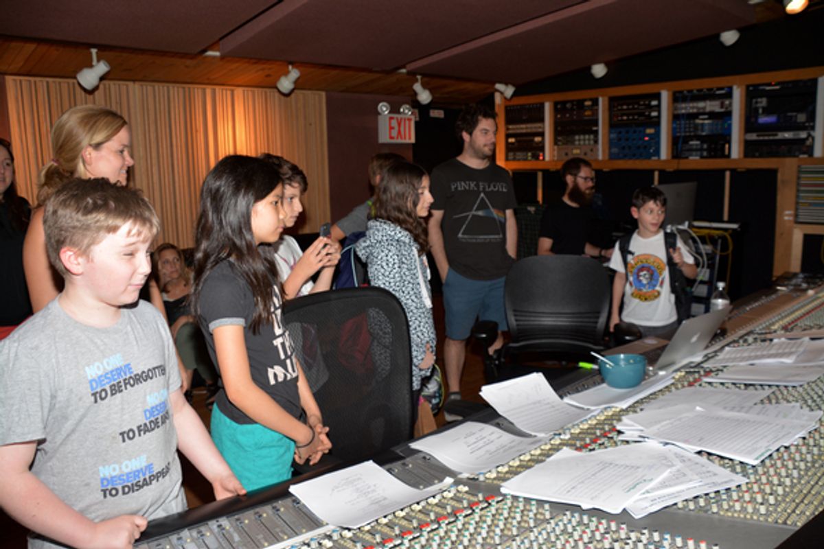 Becky Gulsvig, Justin Collette and the kids listening to the recording at 