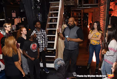 James Monroe Iglehart with students Photo