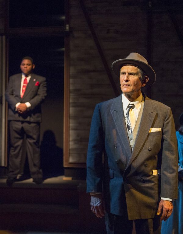 Doremus Jessup (Vic Prosak - right), a liberal newspaper editor, questions the candid Photo