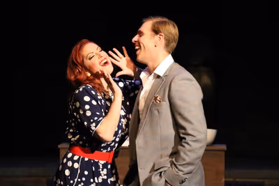 Actors Meghan Murphy and Brandon Dahlquist in Porchlight Revisits "Woman of the Year® Photo