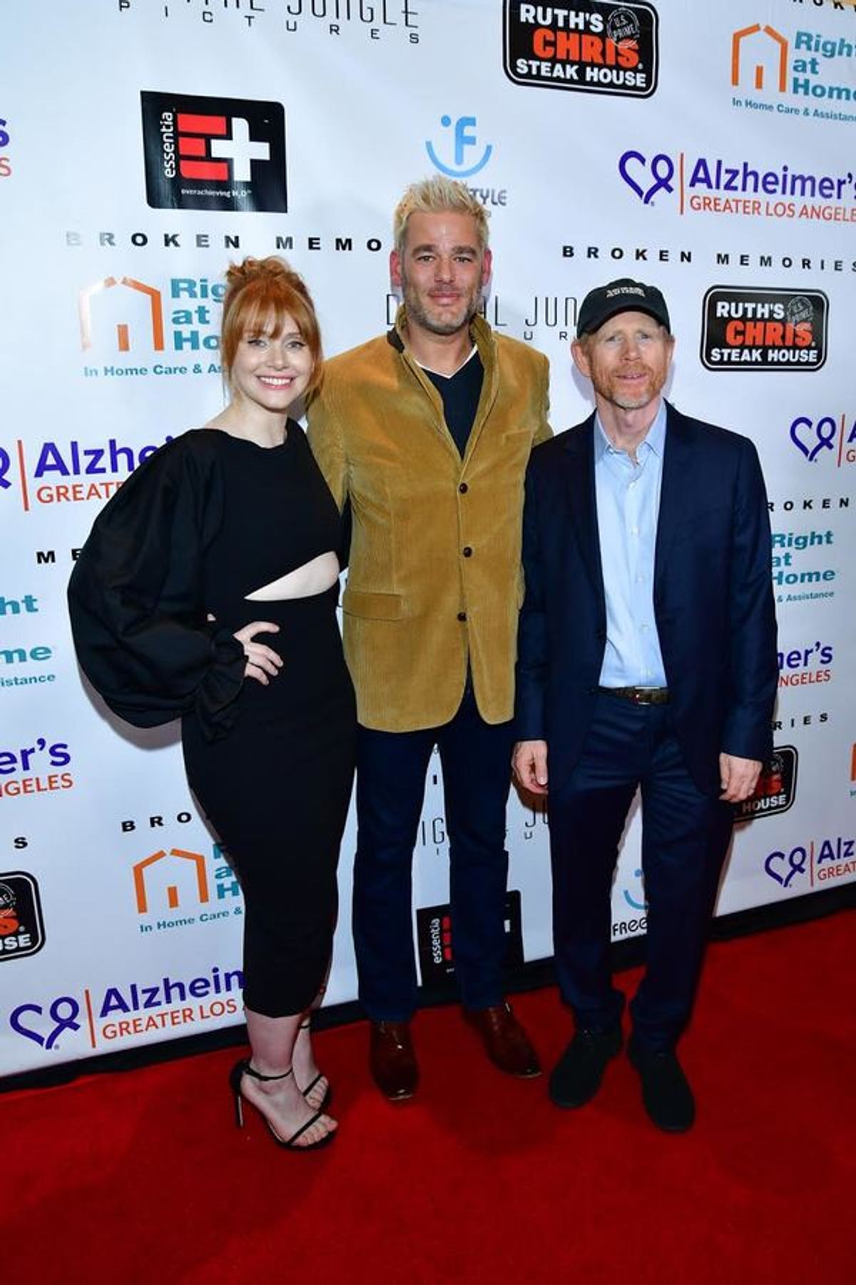 Pictured (L-R) Bryce Dallas Howard, Ron Howard, and ALZGLA VP Kara Bonela last evening at the Broken Memories premiere starring Rance Howard. Bonela presented the Howard family with a framed photo of Rance and Judy Howard from ALZGLA's 'Let's Face It Toge at 