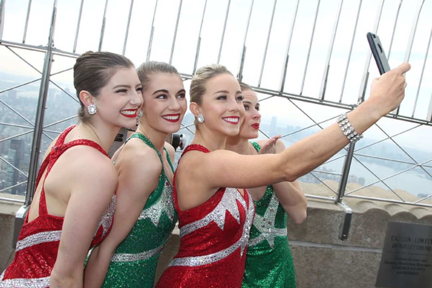 Photo Flash: The Rockettes Turn Empire State Building Red & Green for Tonight's CHRISTMAS SPECTACULAR Opening  Image