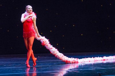 Smuin dancer Erica Felsch struts across the stage with
the world's longest feather bo Photo