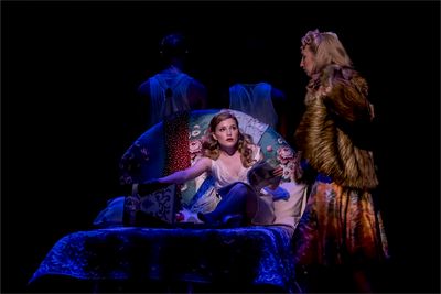 Isabella Jane and Emma Kingston, with members of the company of EVITA Photo