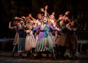 Carrie Hitchcock, center (Miss Hannigan) performs with the LIGHT cast in rehearsal fo Photo