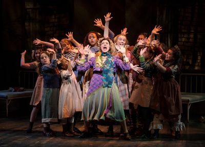 Carrie Hitchcock, center (Miss Hannigan) performs with the LIGHT cast in rehearsal fo Photo