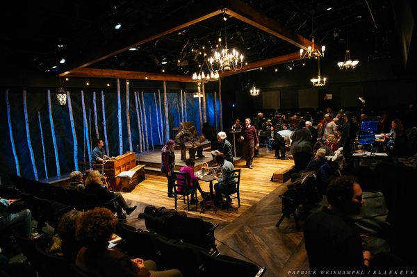 Mont Chris Hubbard plays music as Merideth Kaye Clark and Leif Norby gather winter me Photo