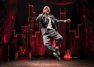 Scrooge (GQ, at center) embraces the magic of the holiday season in Chicago Shakespea Photo