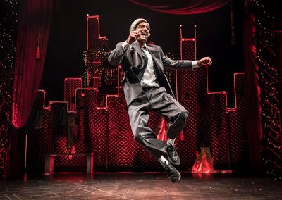 Scrooge (GQ, at center) embraces the magic of the holiday season in Chicago Shakespea Photo