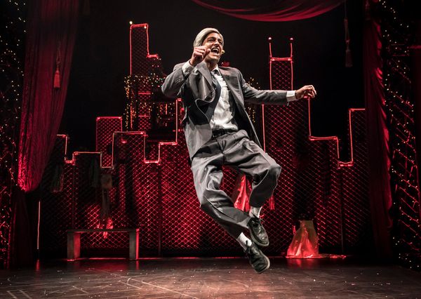 Scrooge (GQ, at center) embraces the magic of the holiday season in Chicago Shakespea Photo