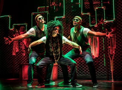 A Rastafarian Jacob Marley (JQ, center) and his crew of reggae spirits (left to right Photo