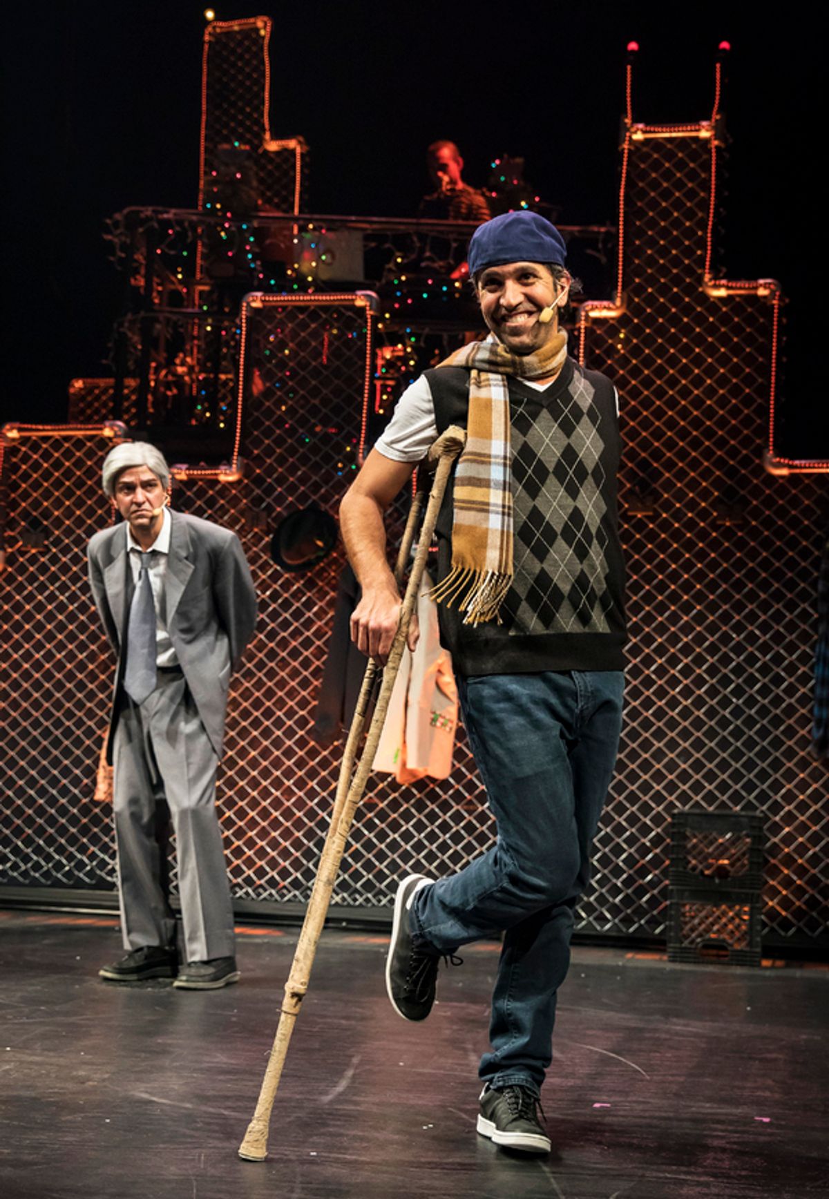 Lilâ€™ Tim (JQ, at center) charms with his classic refrain â€"God bless us errâ€™bodyâ€ while Scrooge (GQ) looks on in Chicago Shakespeare Theaterâ€™s production of Q Brothers Christmas Carol, presented in The Yard at Chicago Shakespeare, November 21â€“D at 