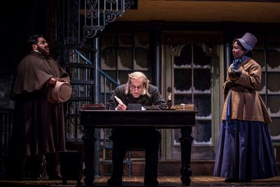 Jonah Winston (Ortle), Larry Yando (Ebenezer Scrooge) and Penelope Walker (Mrs. Crumb Photo