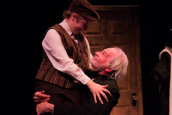 AUDREY STOWE (Tiny Tim) and JOSEPH GRANT (Scrooge) from the Lakewood Playhouse Produc Photo