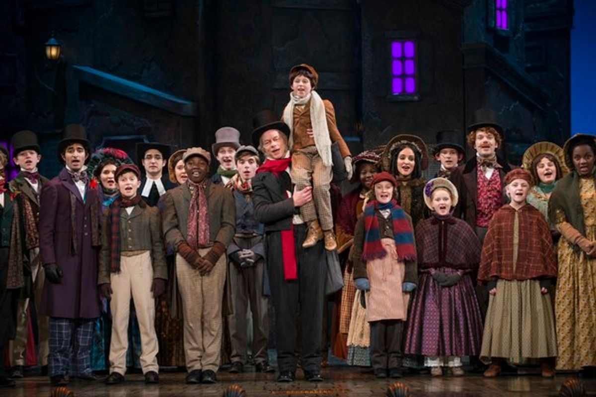 Milwaukee Repertory Theater presents A Christmas Carol in the Historic Pabst Theater from November 28 to December 24, 2017. Left to Right: Jonathan Wainwright and Ashley Bock with the company of A Christmas Carol. Photo by Michael Brosilow. at 