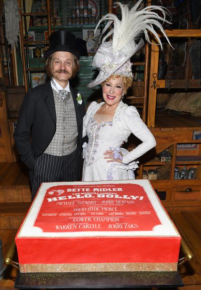 David Hyde Pierce (L) surprises Bette Midler at her birthday celebration at Broadway' Photo