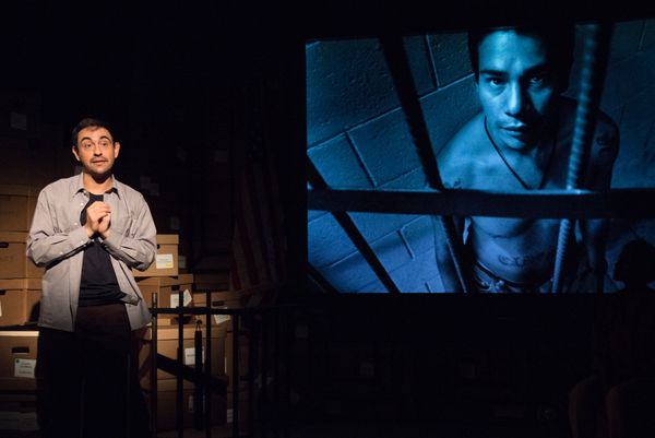 Camilo Almonacid in front of photo image shot by Donna DeCesare Photo