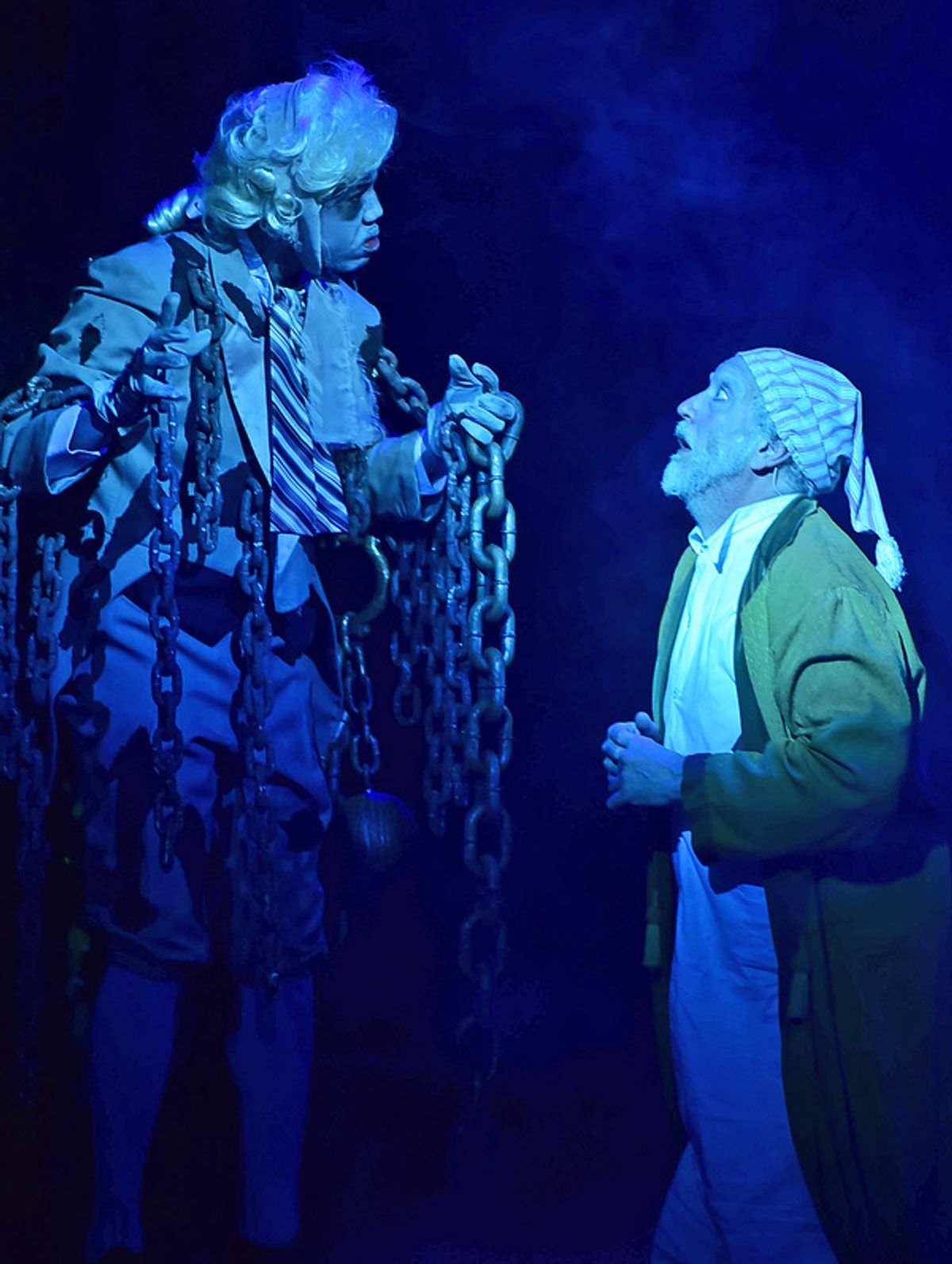The ghost of his business partner Jacob Marley (Joshua L.K. Patterson) visits Ebenezer Scrooge (Jeff Stockberger) on the night of Christmas Eve at 