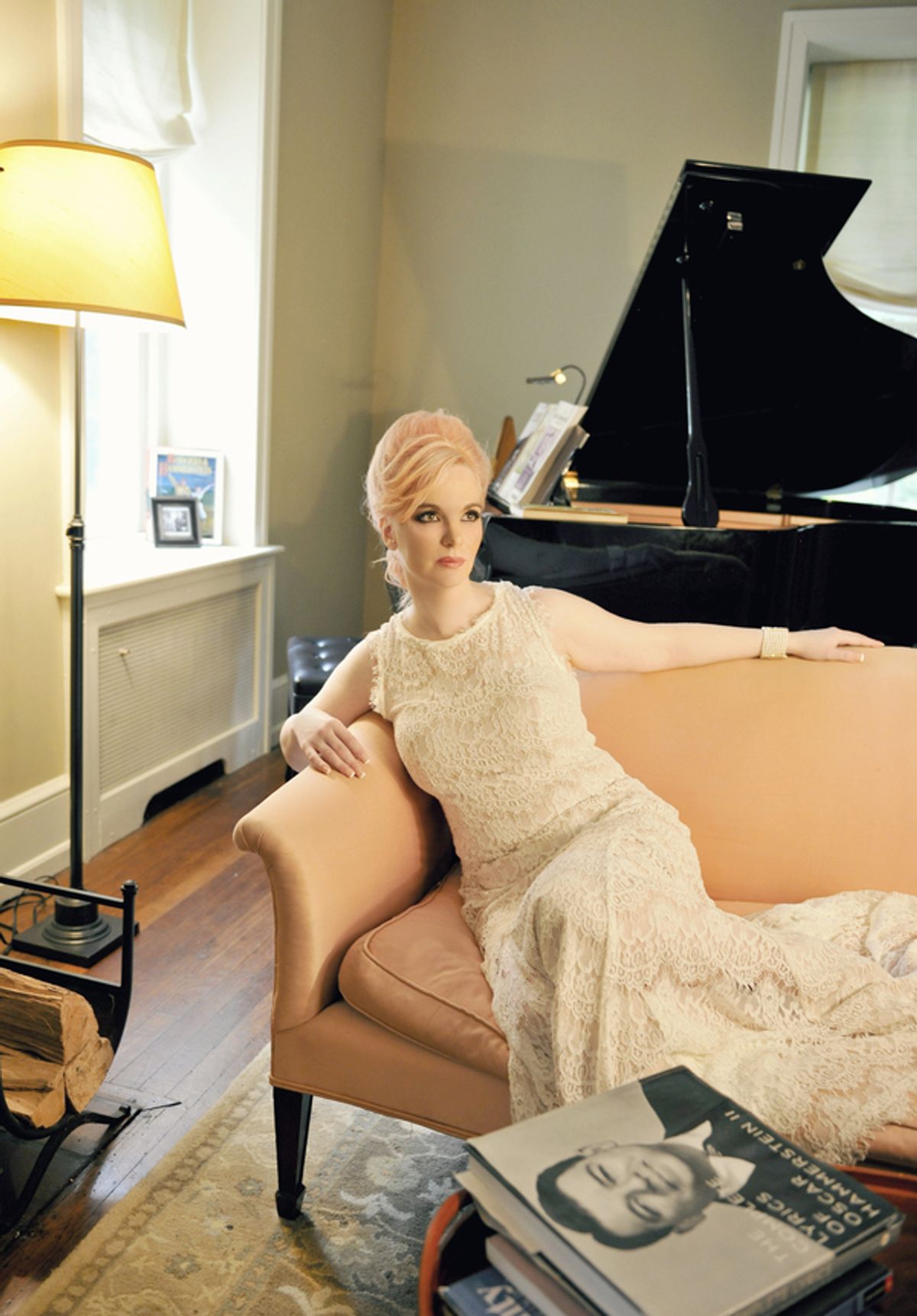 Doreen Taylor lounges  in Oscar Hammersteinâ€™s former living room in a camelback sofa similar to the one used by the Hammerstein family during their tenure there at 
