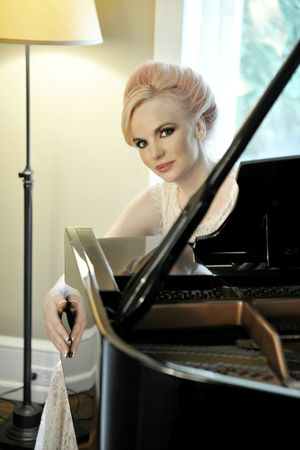 Doreen Taylor sits behind the piano gracing the living room where Oscar Hammerstein spent time with his family during the most productive period of his life @ BroadwayWorld Doreen Taylor sits behind the piano gracing the living room where Oscar Hammerstein s Photo